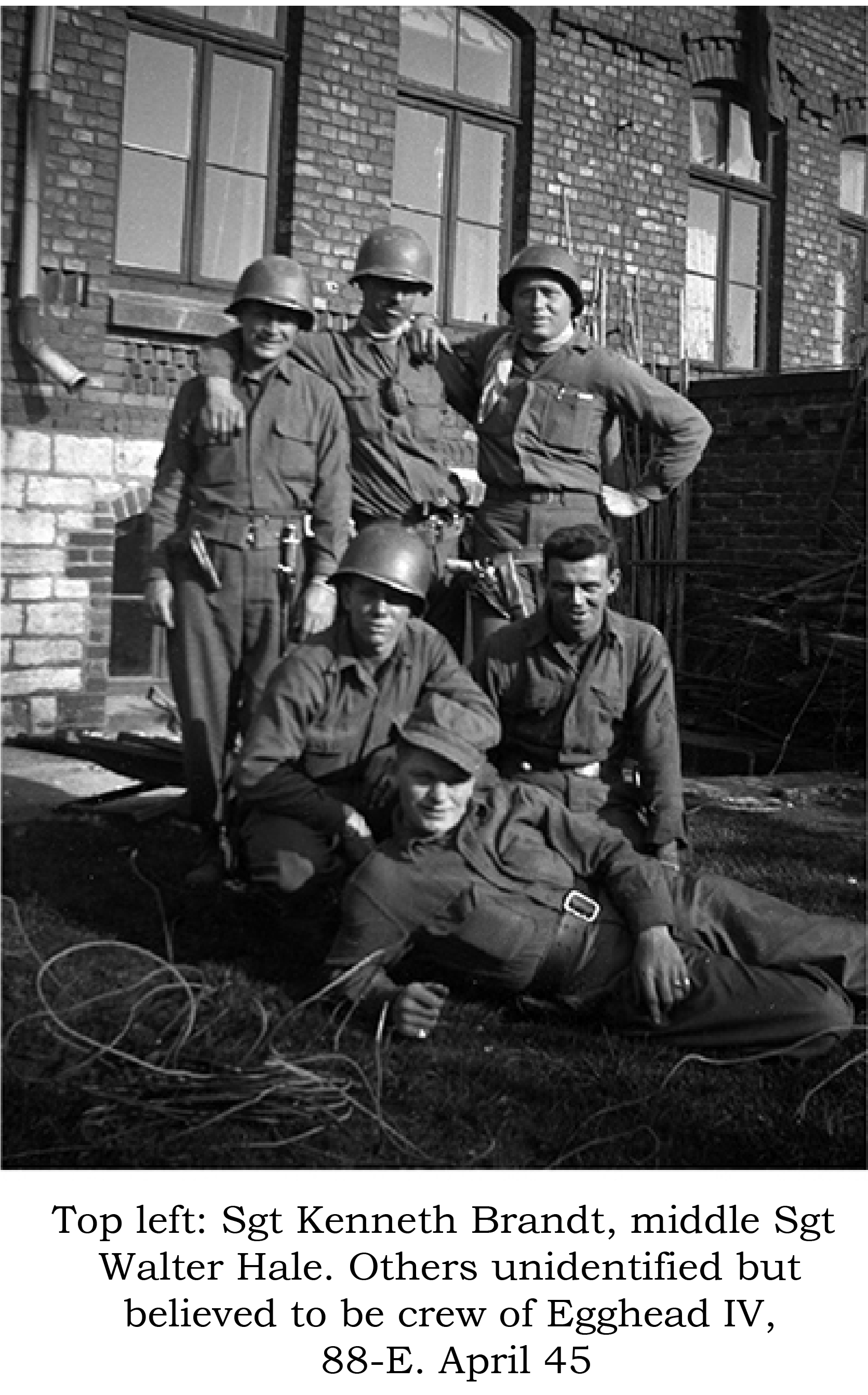 Sgt. Walter Hale, center with grenade, others unknown, believed to be crew of tank Egghead IV, 88-E